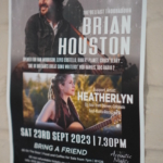 A poster on a brick wall for Acoustic Nights at The Barn, including Brian Houston and Heatherlyn.